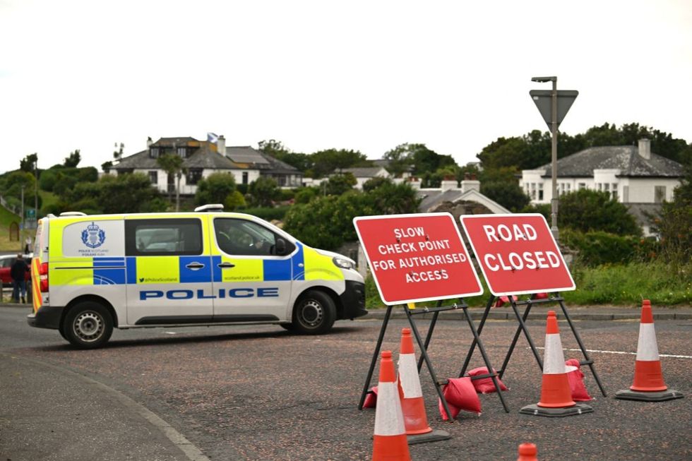 Police secure the road on the perimeter of Trump Turnberry Golf Courses