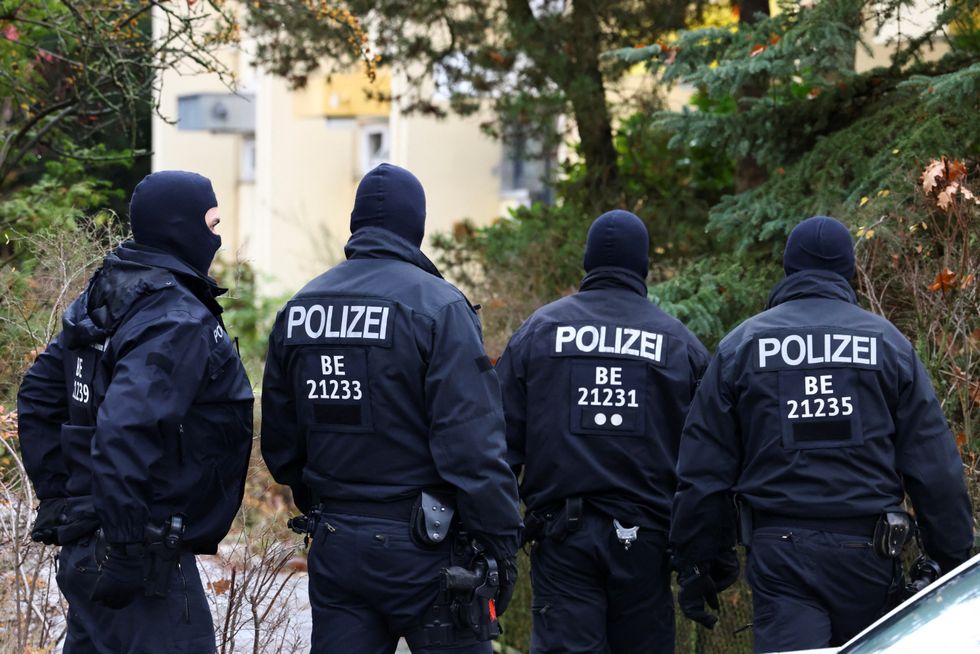 Police secures the area after 25 suspected members and supporters of a far-right group were detained during raids across Germany, in Berlin, Germany December 7, 2022.   REUTERS/Christian Mang