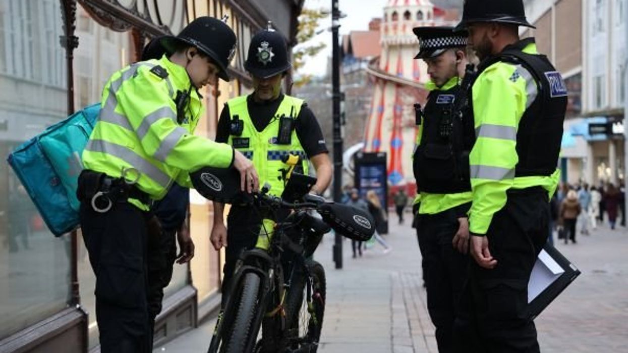 Police stopping e-bike rider