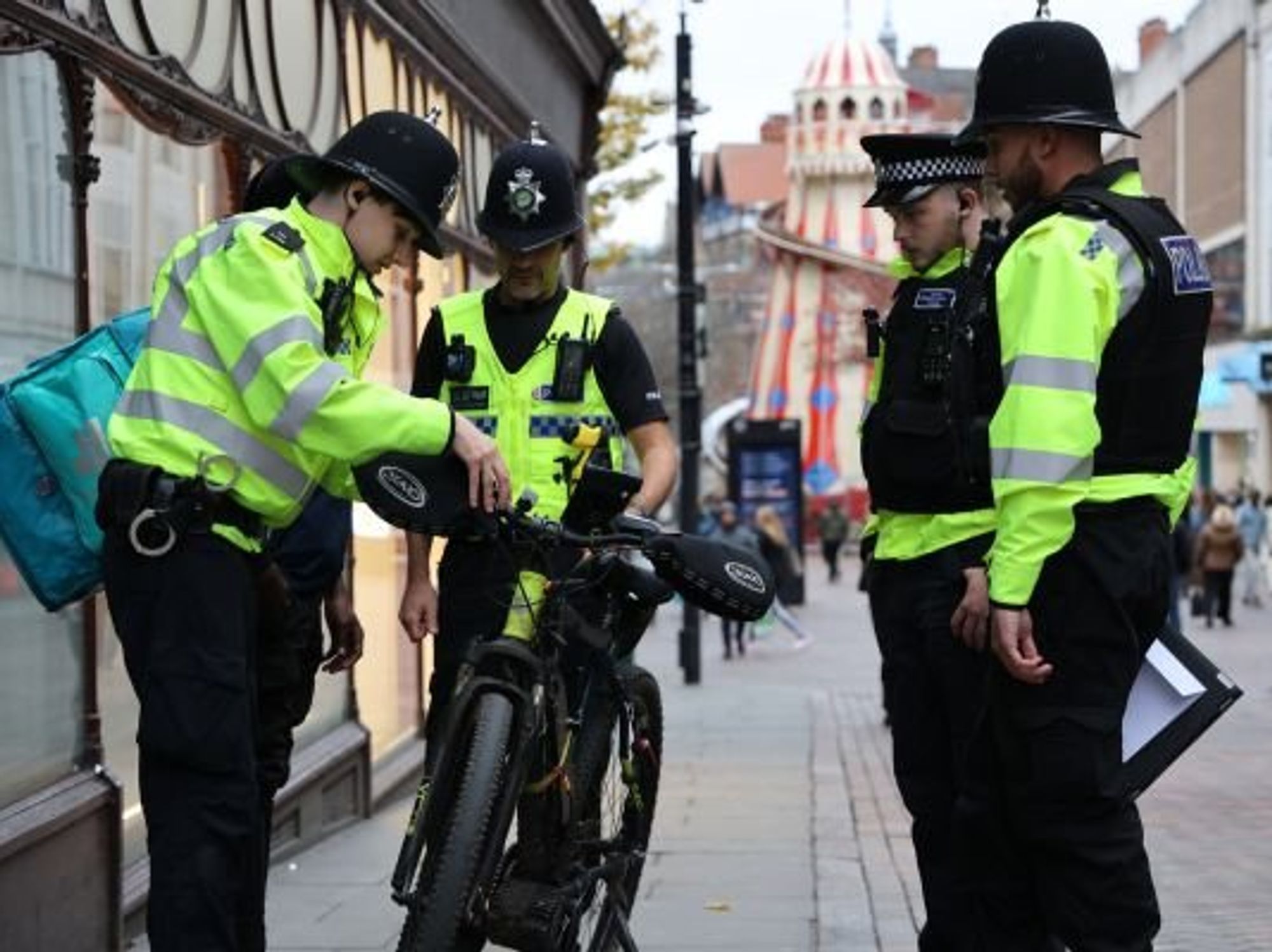 Police stopping e-bike rider
