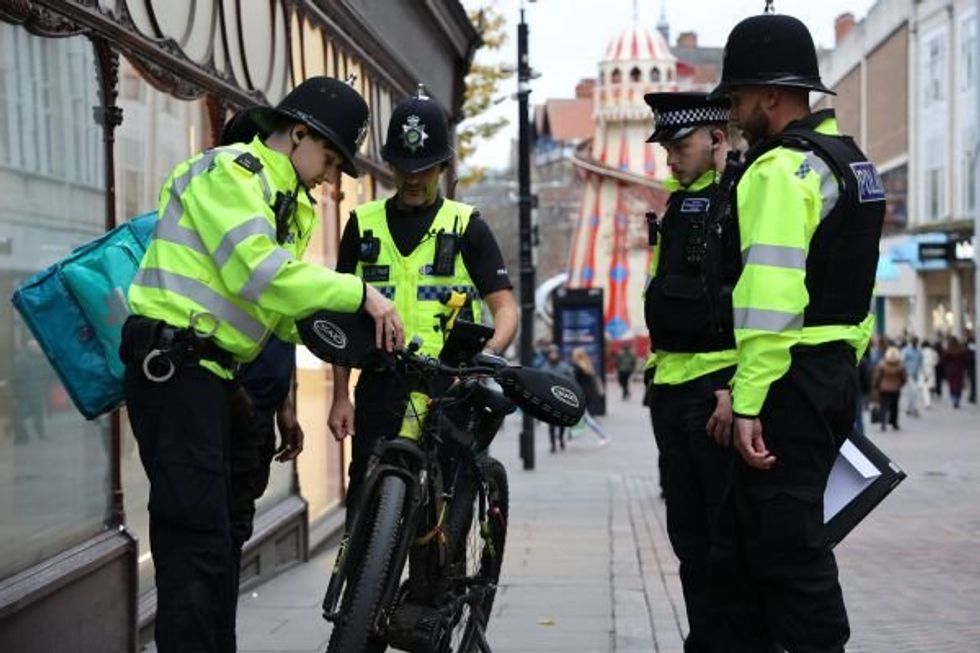 Police stopping e-bike rider
