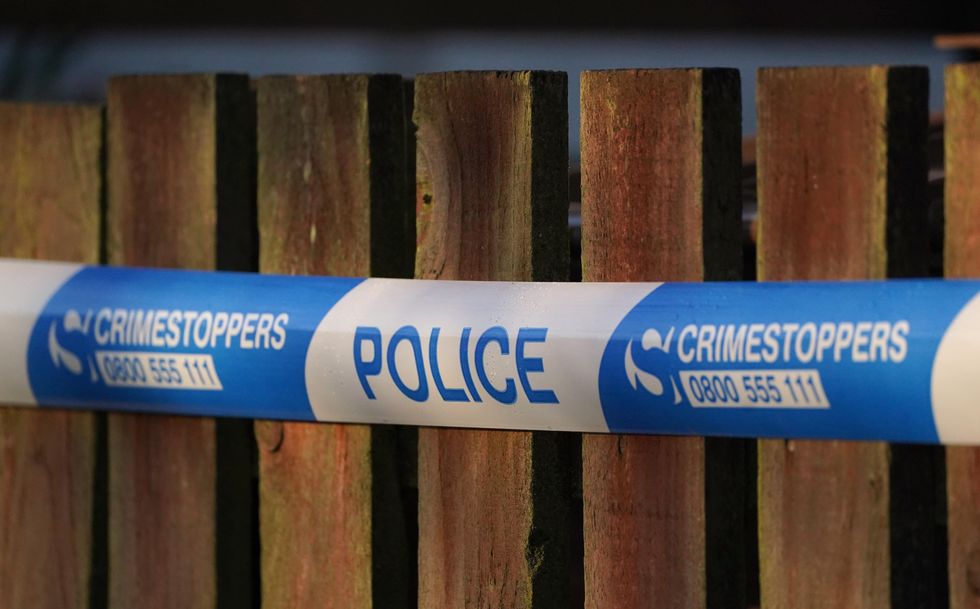 Police tape at an address in Livingston, West Lothian after Denis and Mary Fell (both aged 73) were found dead in the house on Boxing Day. Picture date: Tuesday December 28, 2021.