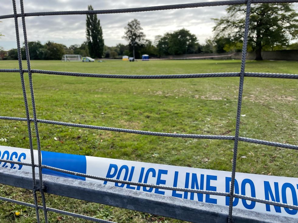 Police tape at the scene on a playing field in Craneford Way, Twickenham, south-west London, where an 18-year-old was stabbed on Tuesday afternoon. The teenager was taken to hospital but was pronounced dead just over an hour later. Picture date: Wednesday October 13, 2021.