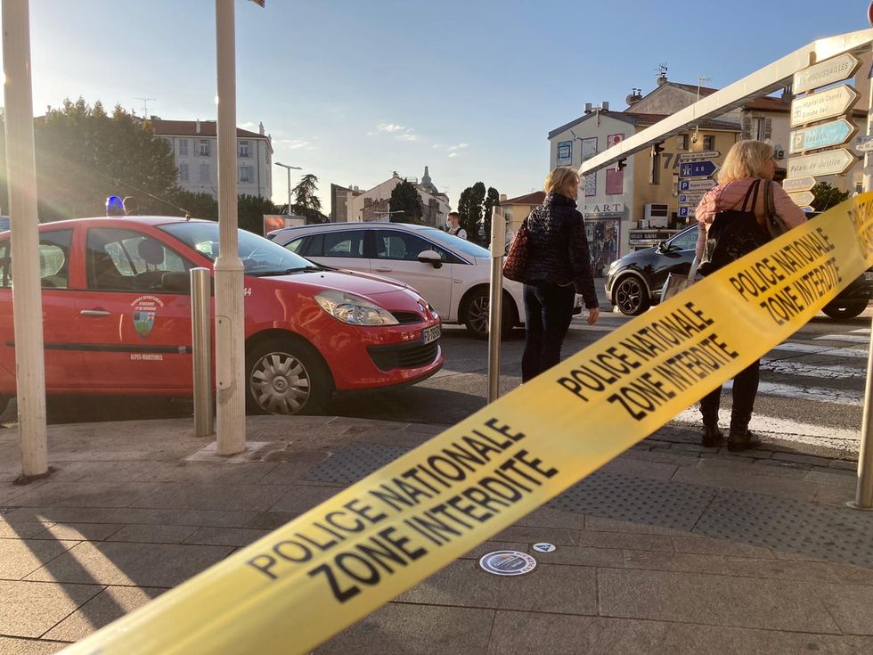 Police tape is seen at the scene where a police officer was stabbed in front of a police station, in Cannes, France.