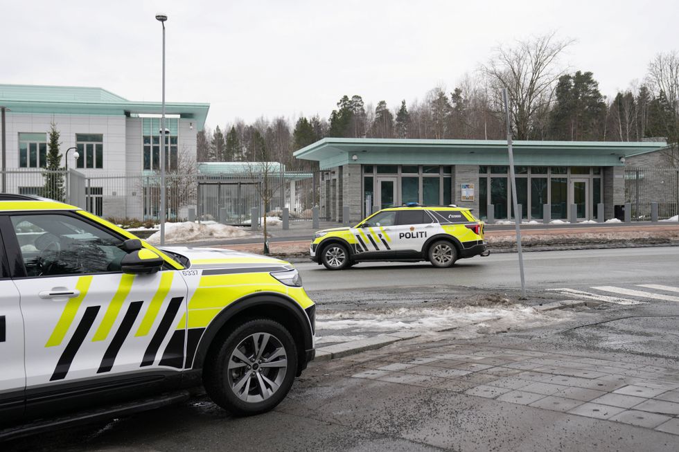 Police vehicles park outside the U.S. Embassy