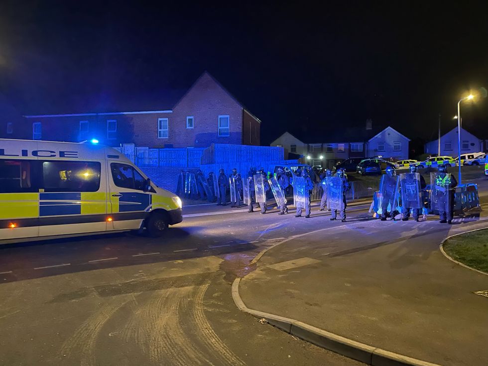 Police were stood in a line at the one end of the road