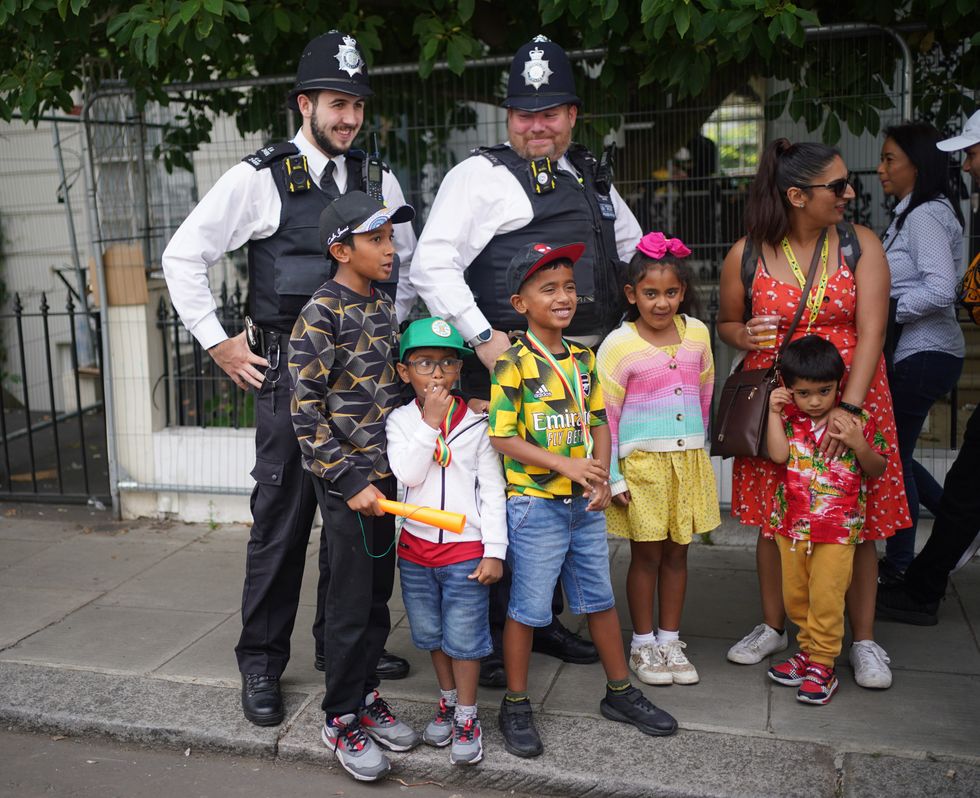 Police with kids at Notting Hill Carnival