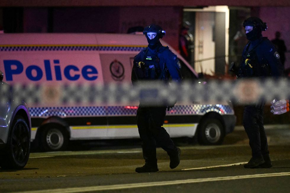 Police work at the scene after a shooting incident at Bondi Beach in Sydney