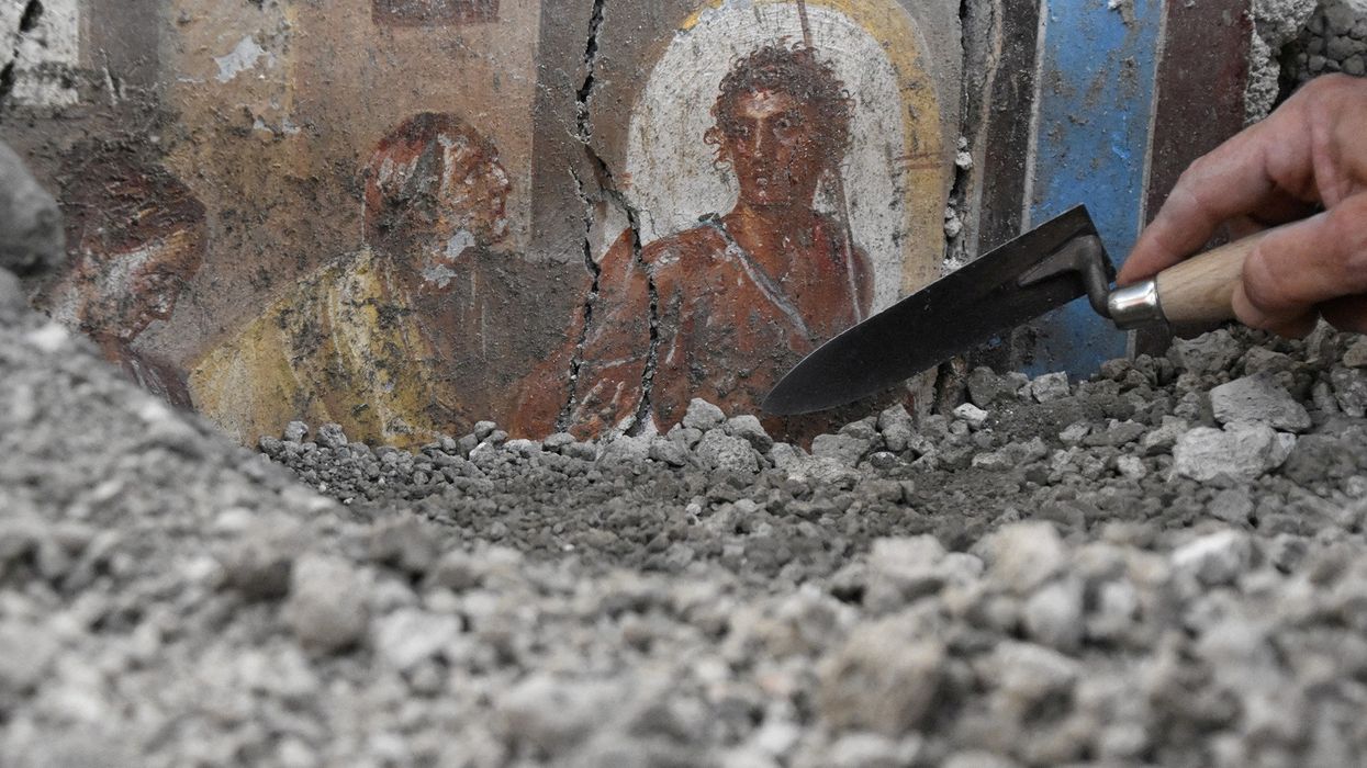 Pompeii fresco and trowel digging
