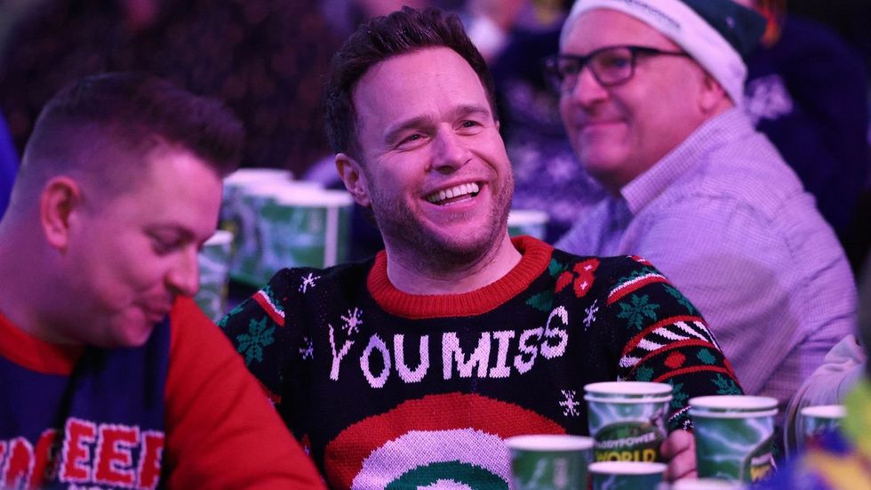 Pop star Olly Murs received a hostile reception from the crowd at Alexandra Palace yesterday when cameras picked him out during the World Darts Championship
