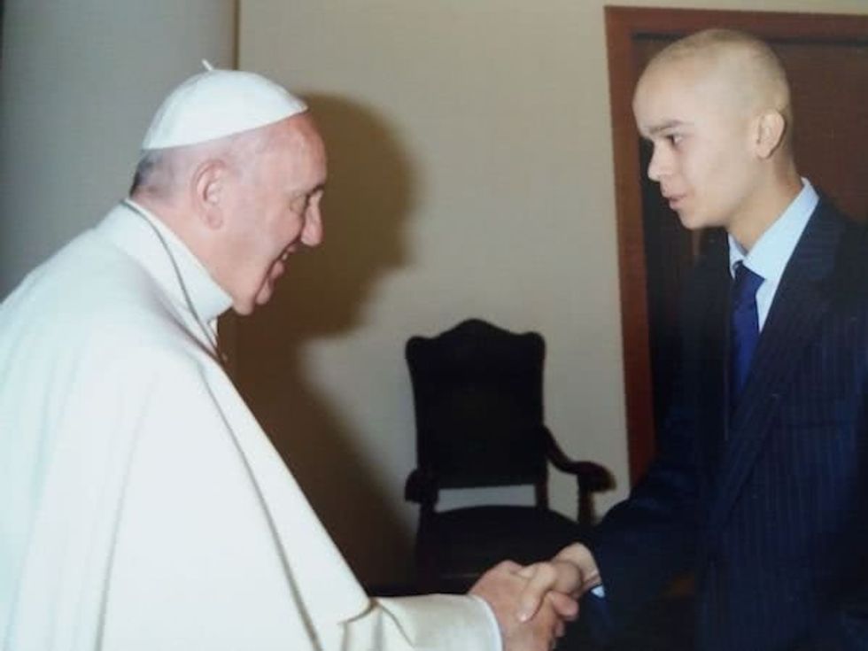 Pope Francis and Pedro Ballester shake hands