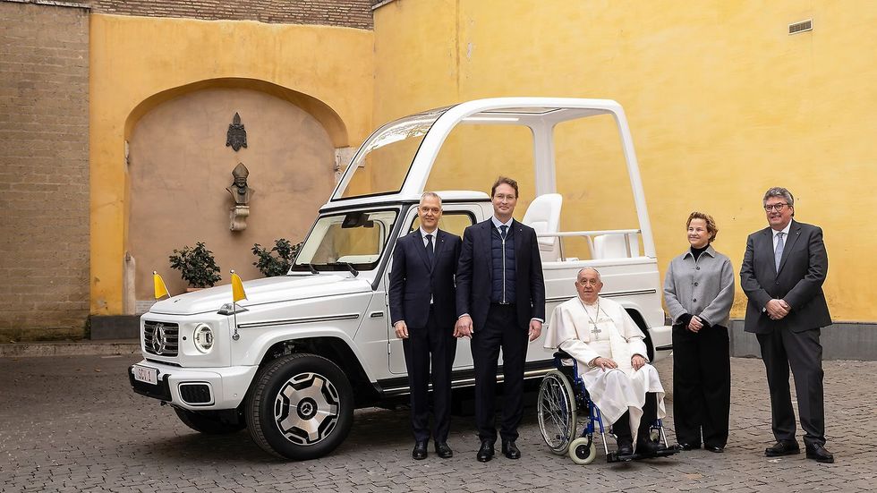 Pope Francis with the Mercedes-Benz Popemobile 