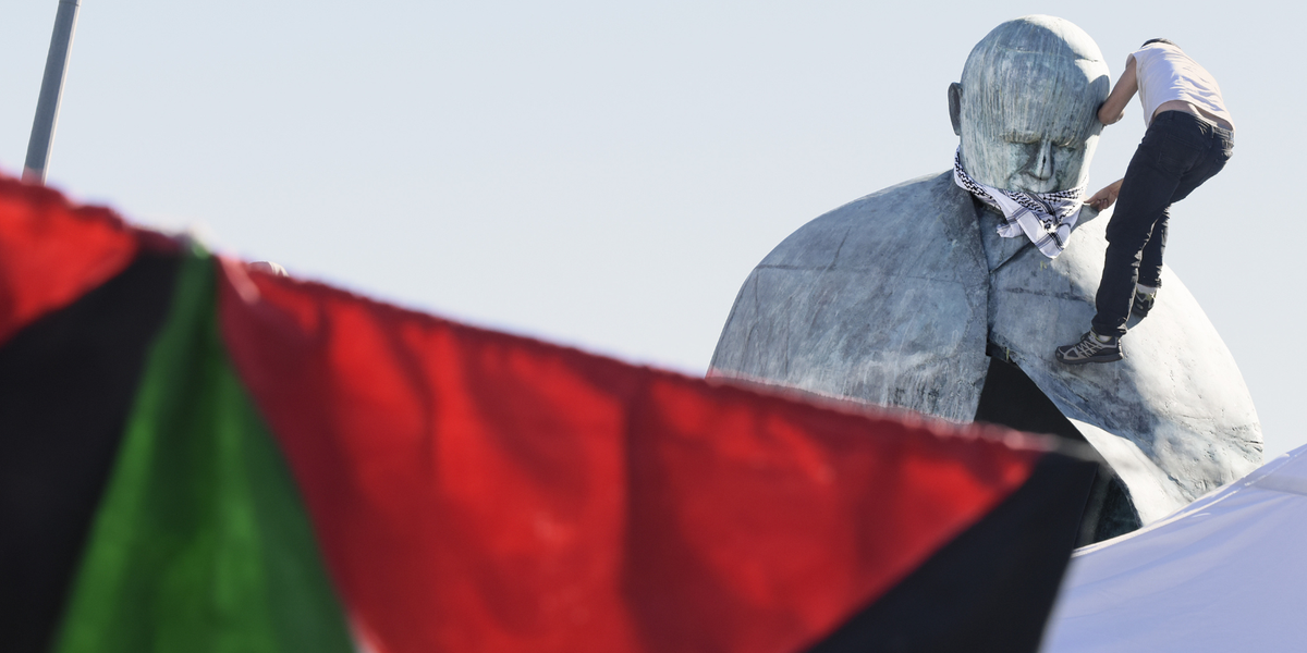 NextImg:Pro-Palestine vandals deface Pope John Paul II statue in latest outbreak of violence in Italy