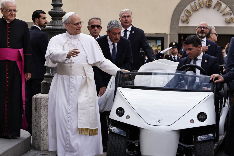 Pope Leo XIV arrives by electric car in Piazza della Libert\u00e0 in Castel Gandolfo to celebrate a Mass in the St. Thomas of Villanova church