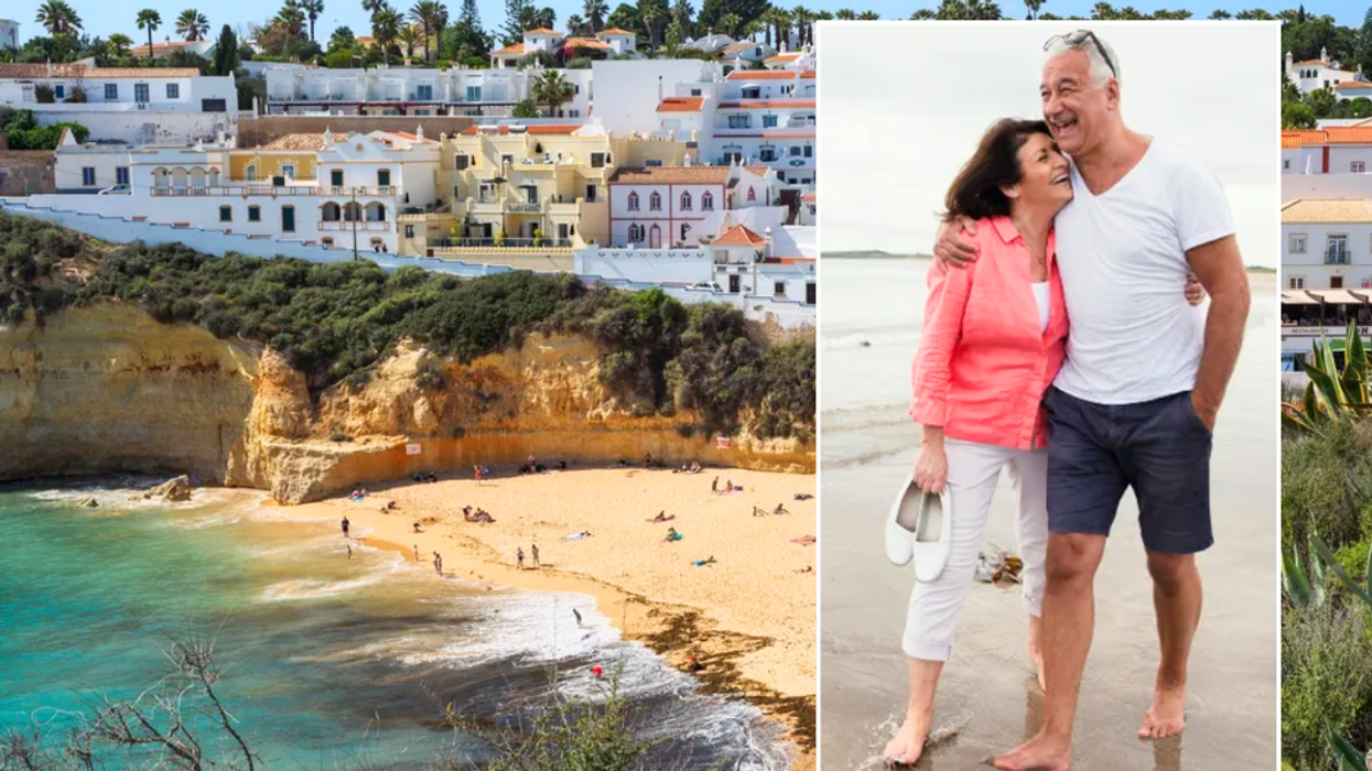 Portugal beach / retired couple walking on beach