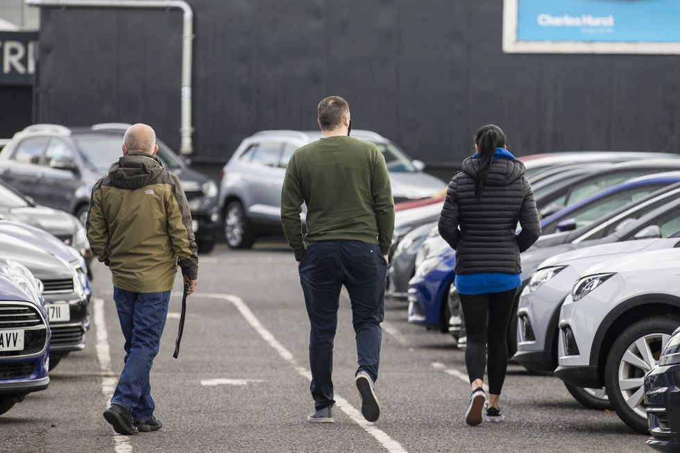 Potential customers walk around Charles Hurst Usedirect used car dealership on Boucher Road in Belfast as restrictions in Northern Ireland ease allowing new and used cars sales.
