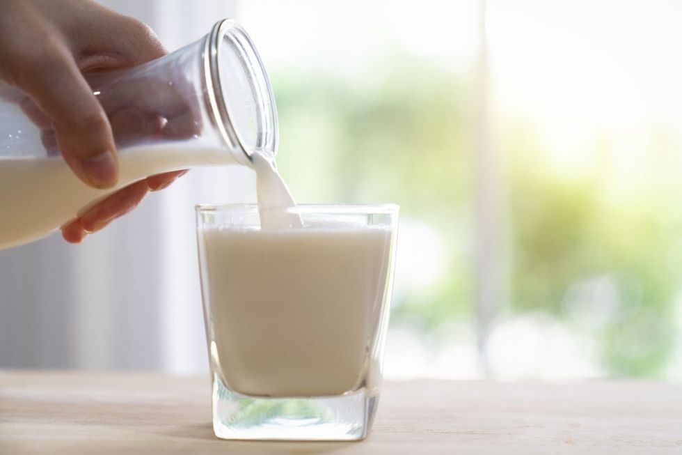POURING GLASS OF KEFIR