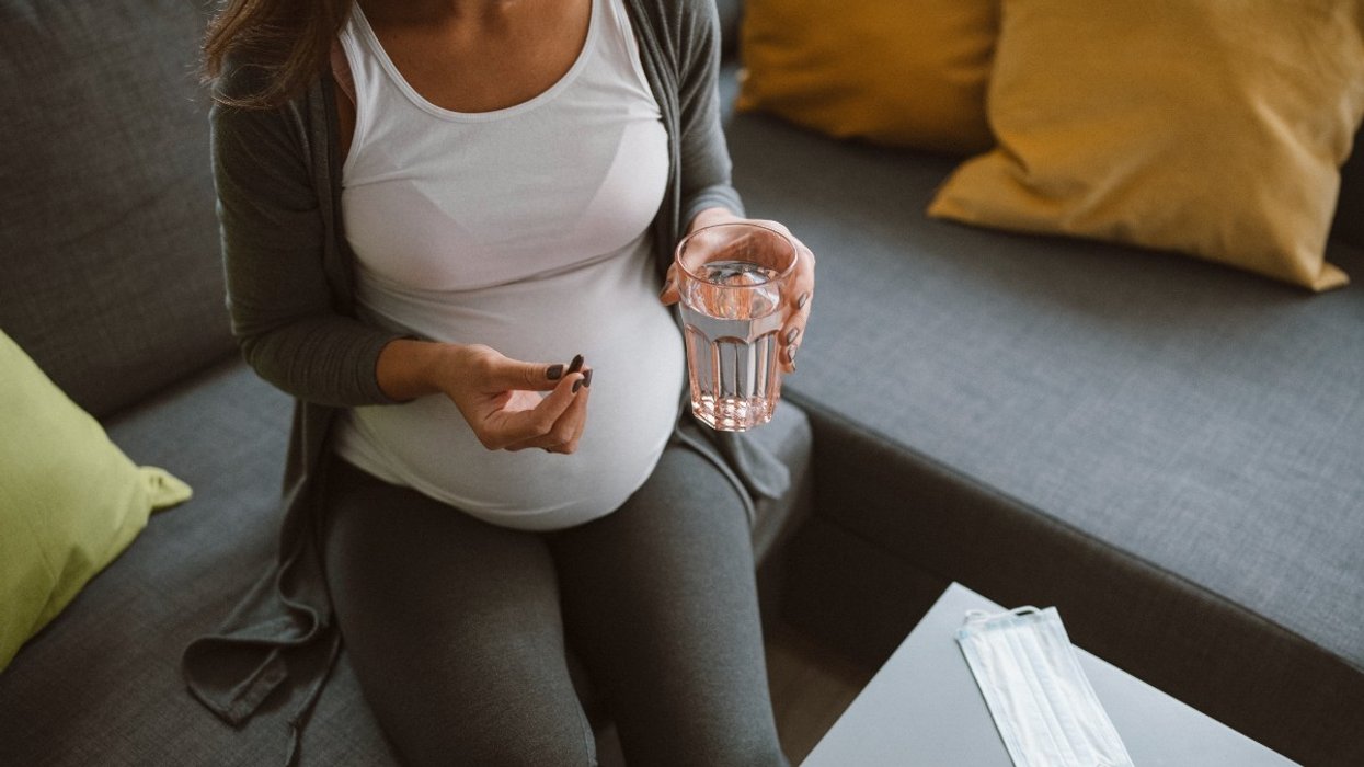 Pregnant woman taking pills