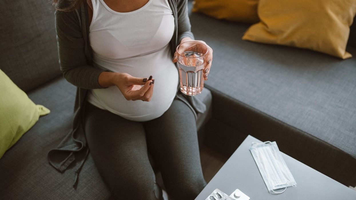 Pregnant woman taking pills