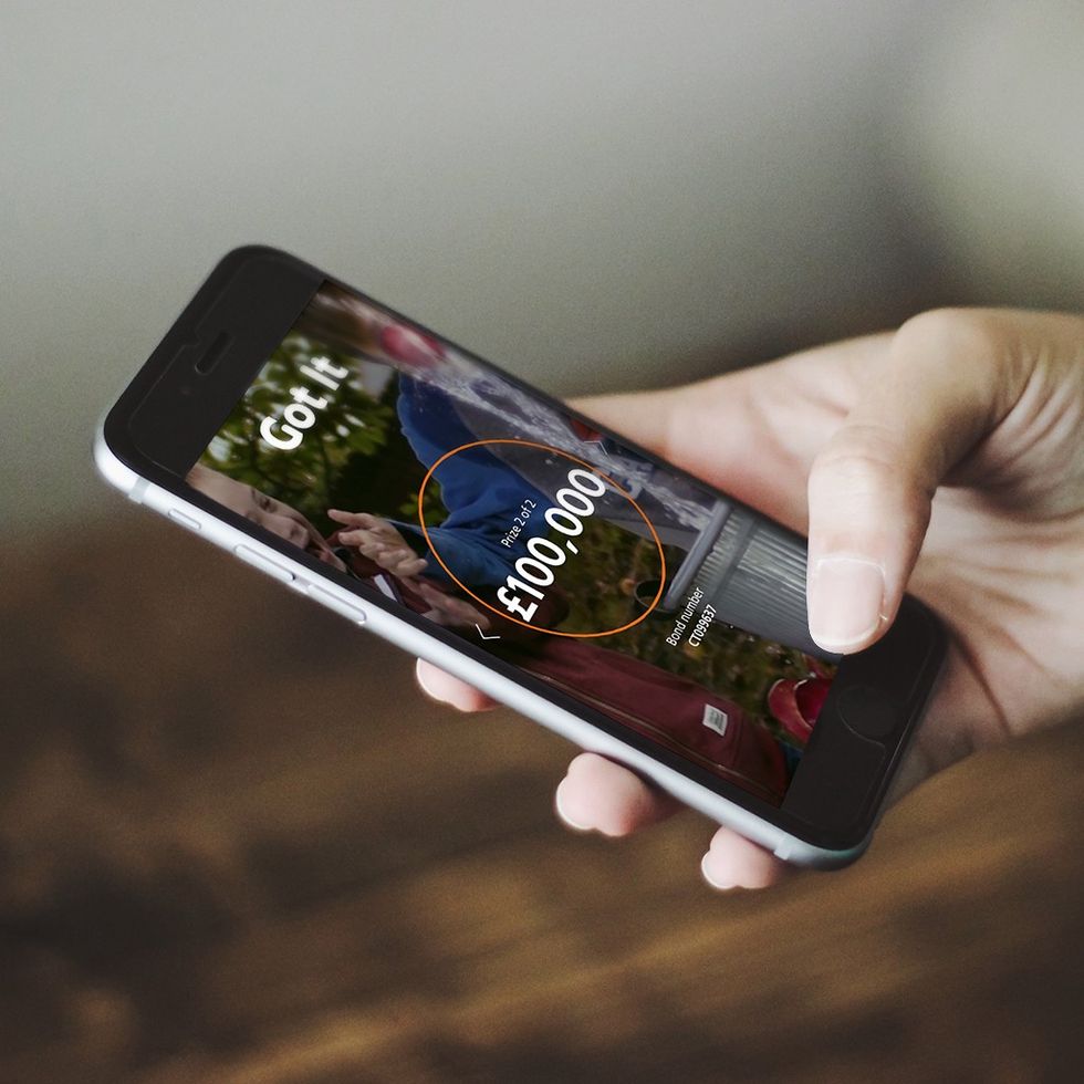 Premium Bonds prize checker app being used by NS&I saver showing a prize of \u00a3100,000