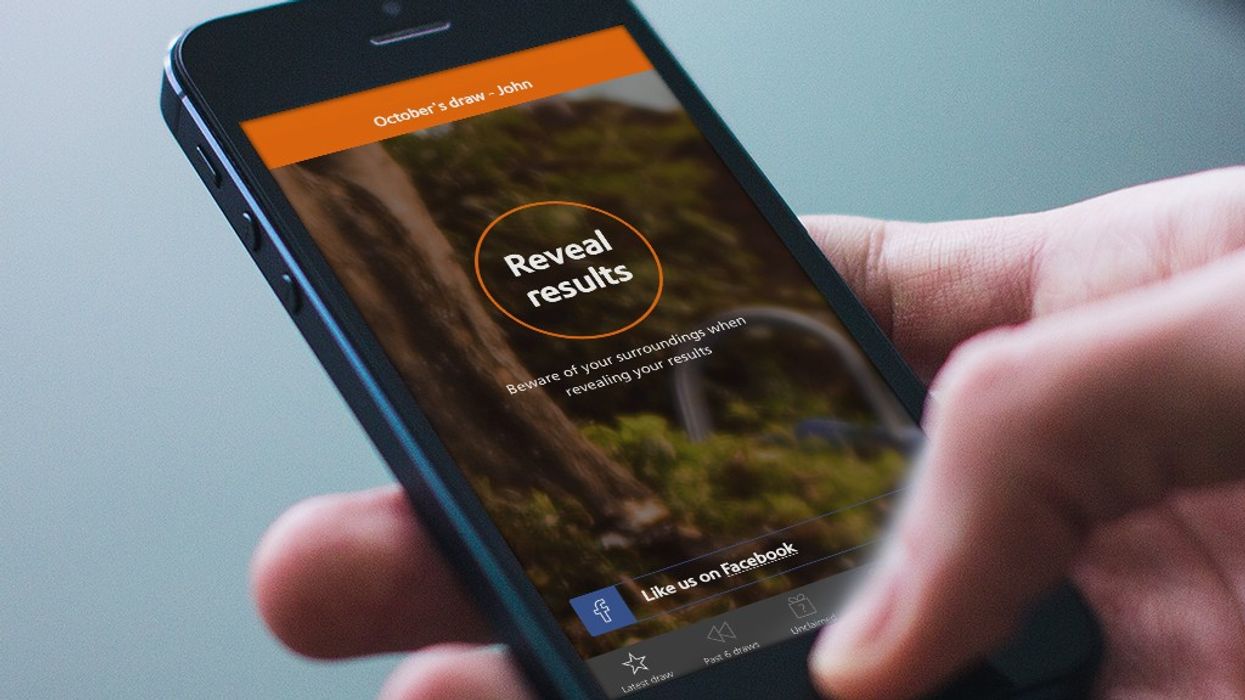 Premium Bonds user uses NS&I app on mobile phone