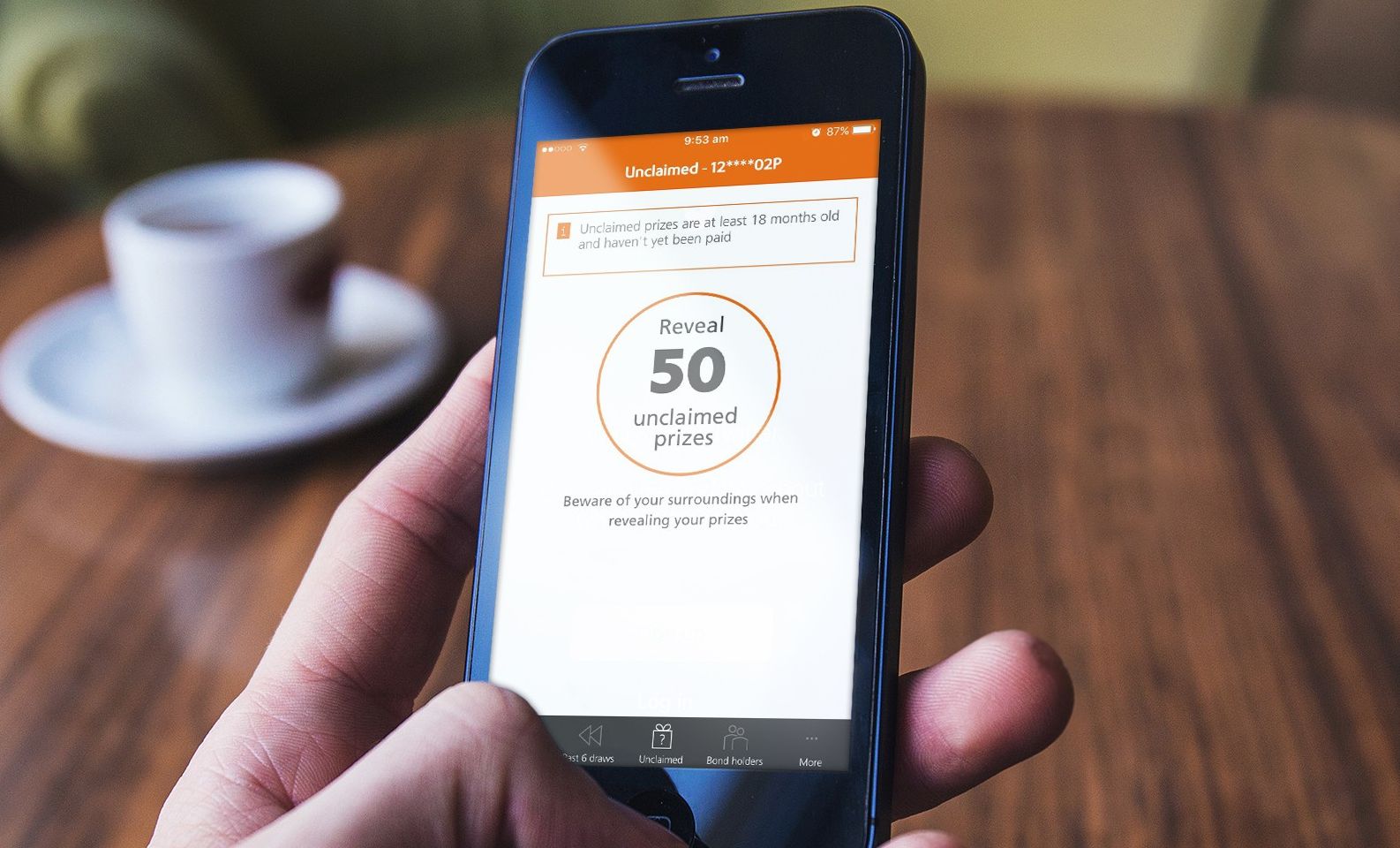 Premium Bonds user using NS&I app to check unclaimed prizes