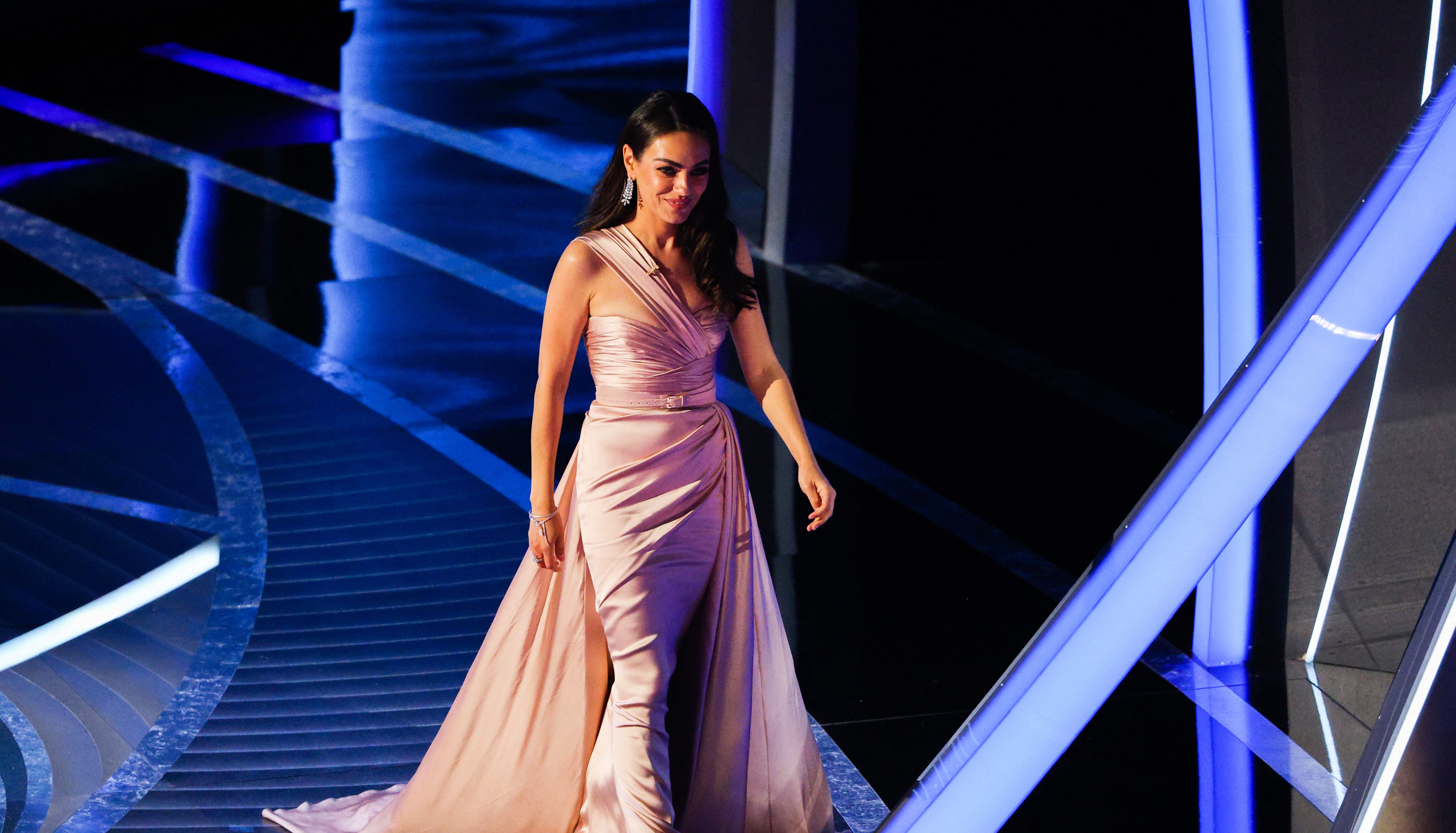 Presenter Mila Kunis arrives on stage at the 94th Academy Awards in Hollywood, Los Angeles, California, U.S., March 27, 2022. REUTERS/Brian Snyder