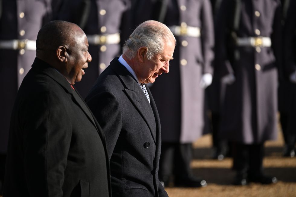 President Cyril Ramaphosa of South Africa, walks with King Charles III as they inspect a Guard of Honour during the ceremonial welcome for his State Visit to the UK, at Horse Guards Parade in London. Picture date: Tuesday November 22, 2022.