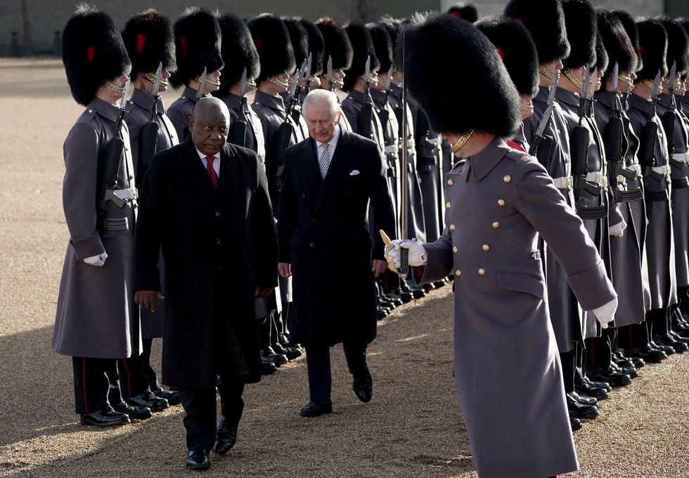 President Cyril Ramaphosa of South Africa, walks with King Charles III as they inspect a Guard of Honour during the ceremonial welcome for his State Visit to the UK at Horse Guards Parade in London. Picture date: Tuesday November 22, 2022.