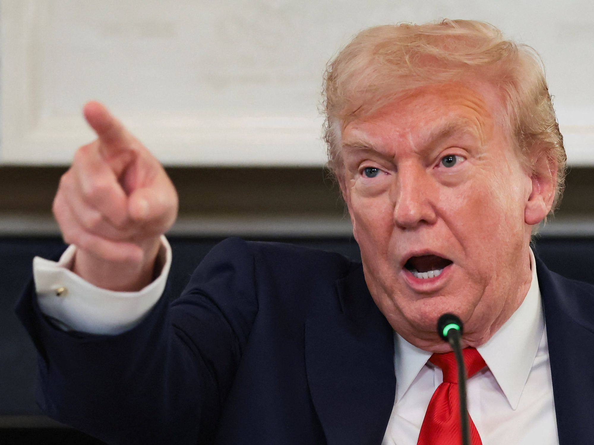 President Donald Trump points a finger as he speaks during a roundtable on antifa,