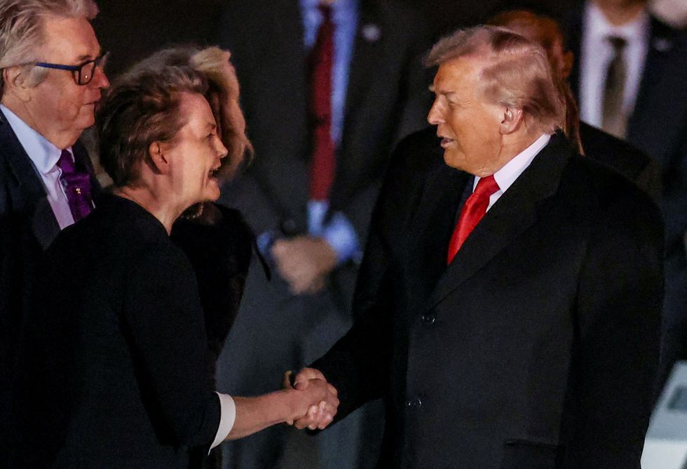 President Donald Trump shakes hands with Foreign Secretary Yvette Cooper