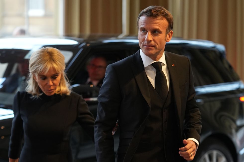 President Emmanuel Macron and his wife Brigitte arrive for a reception hosted by King Charles III for Heads of State and Official Overseas Guests, at Buckingham Palace in London, ahead of the funeral of Queen Elizabeth II. Picture date: Sunday September 18, 2022.