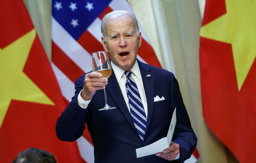 President Joe Biden raises a toast during a luncheon with Vietnam's President Vo Van Thuong