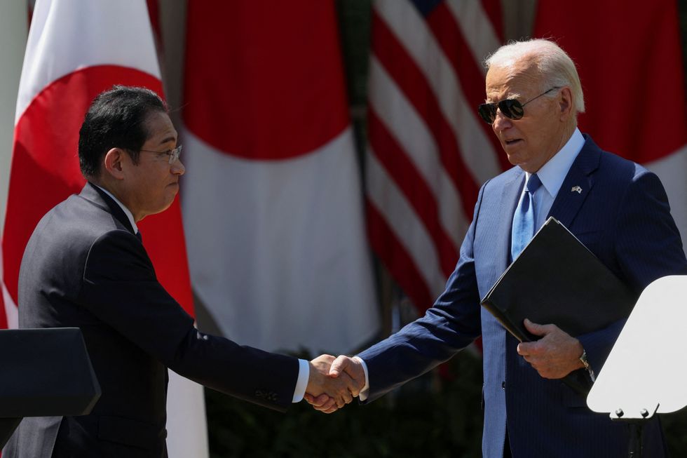 President Joe Biden shake hands with Japanese Prime Minister Fumio Kishida following a joint press conference