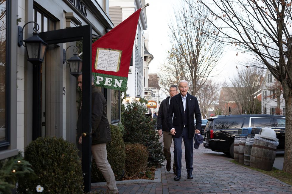 President Joe Biden walks next to Nantucket Bookworks in Nantucket