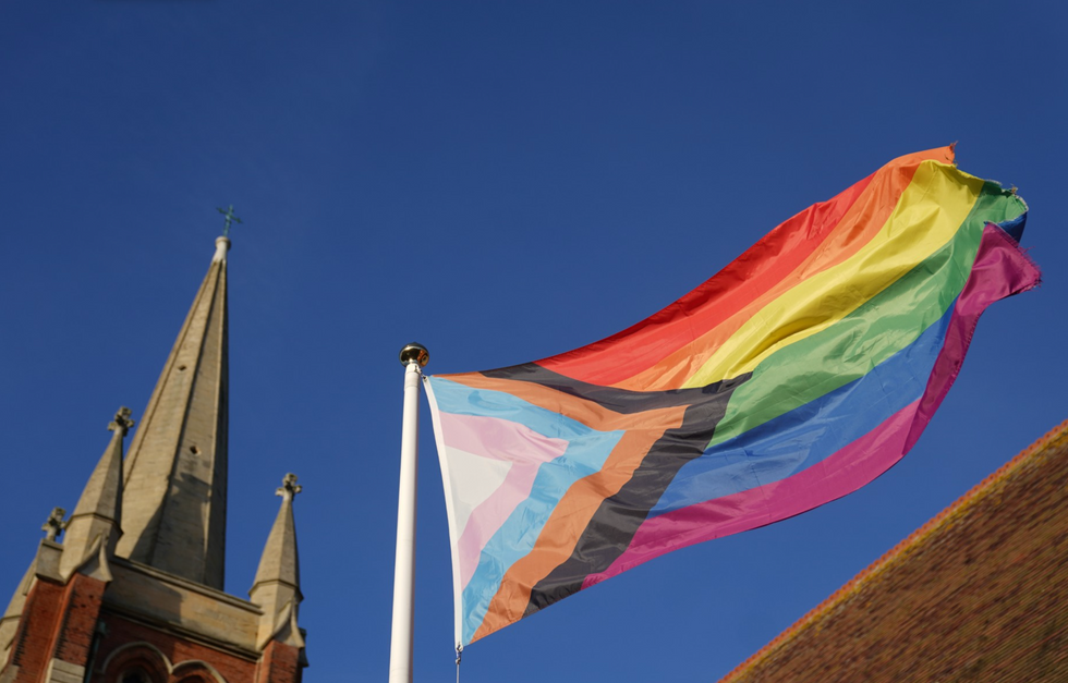 Pride flag in front of a church