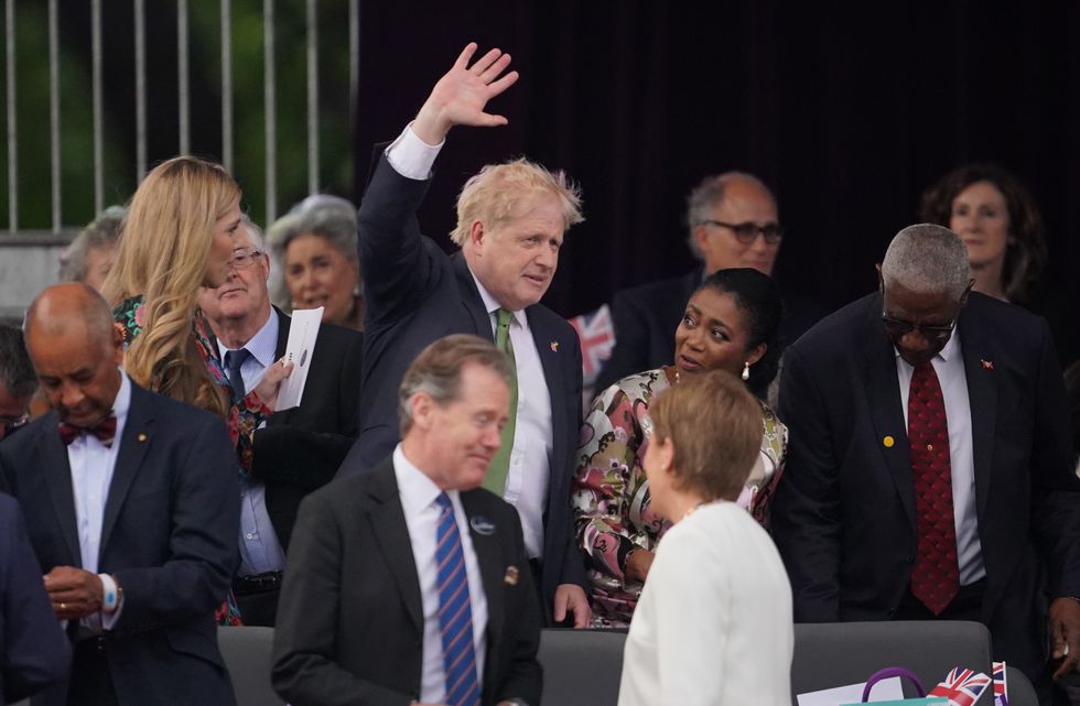 Prime Minister Boris Johnson and his wife Carrie Johnson take their seats for the Platinum Party at the Palace staged in front of Buckingham Palace, London