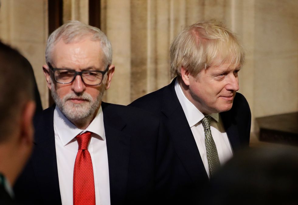 Prime Minister Boris Johnson and opposition Labour Party Leader Jeremy Corbyn walk through the Members' Lobby in the House of Commons during the State Opening of Parliament by Queen Elizabeth II, at the Palace of Westminster in London.