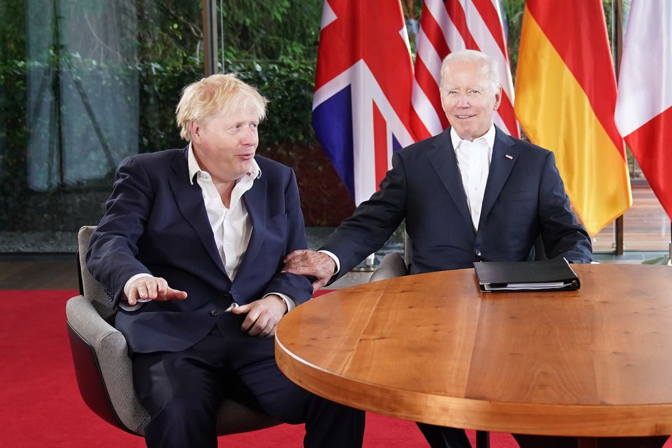 Prime Minister Boris Johnson and US President Joe Biden during a 'quad' meeting at the G7 summit in Schloss Elmau, in the Bavarian Alps, Germany. Picture date: Tuesday June 28, 2022.
