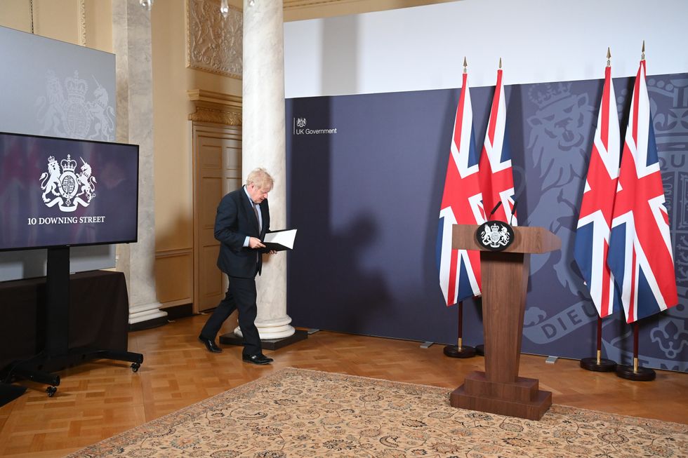 Prime Minister Boris Johnson arriving for a media briefing in Downing Street, London.