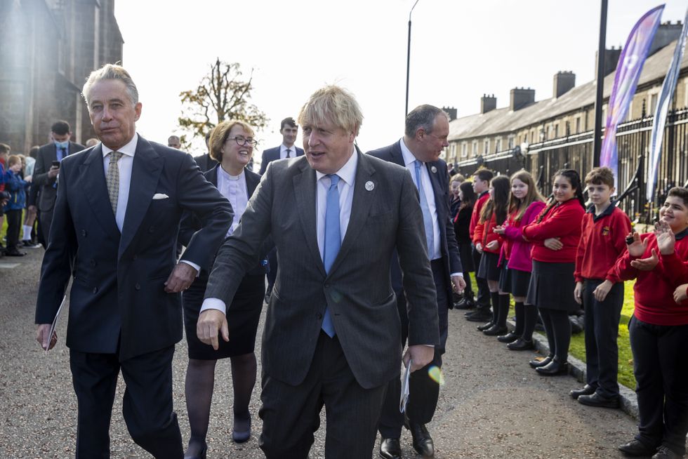 Prime Minister Boris Johnson (centre) attends a service to mark the centenary of Northern Ireland at St Patrick's Cathedral in Armagh in October 2021.