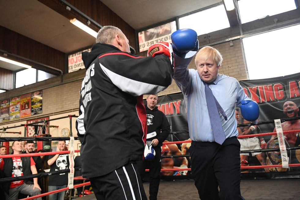 Prime Minister Boris Johnson during a visit to Jimmy Egan's Boxing Academy at Wythenshawe, in 2019