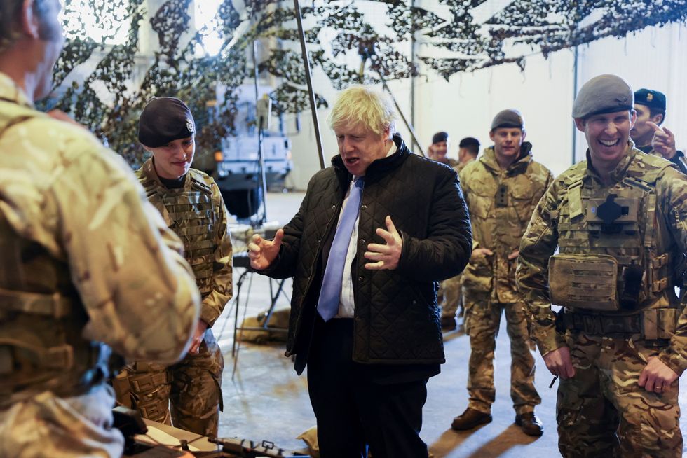 Prime Minister Boris Johnson during his visit to Royal Air Force Station Waddington in Lincolnshire where he met military personnel. Picture date: Thursday February 17, 2022.