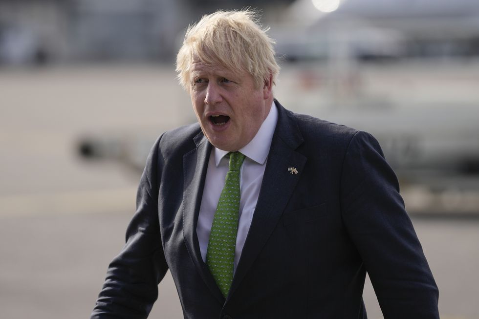 Prime Minister Boris Johnson gets off the plane after landing in Helsinki, Finland. Picture date: Wednesday May 11, 2022.