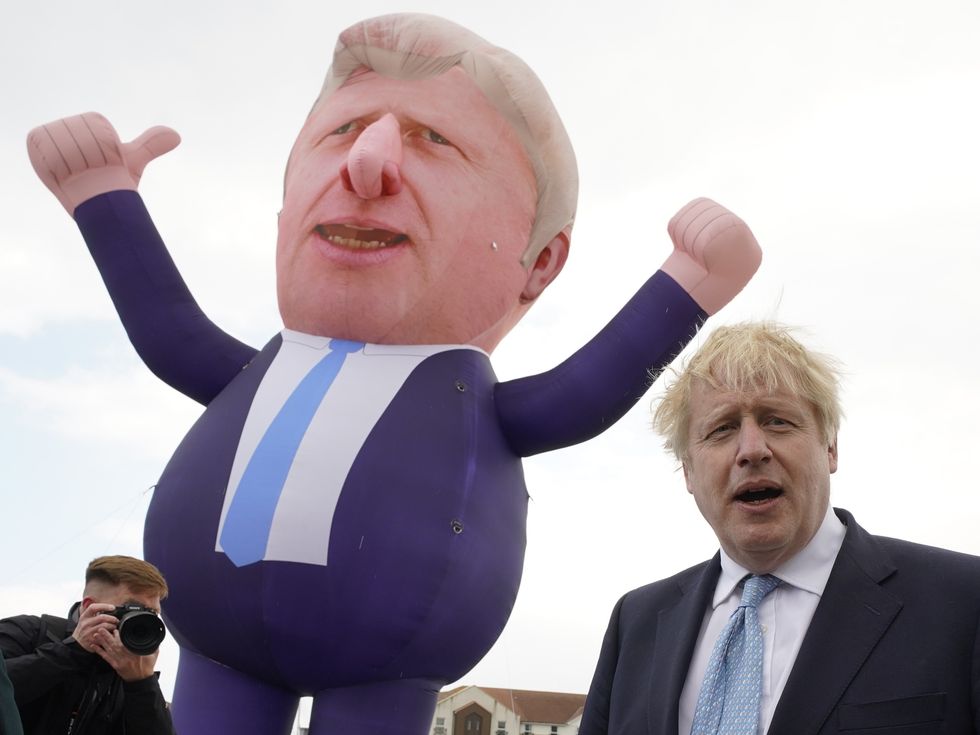 Prime Minister Boris Johnson in front of a giant inflatable of himself as he meets and newly elected MP Jill Mortimer at Jacksons Wharf in Hartlepool