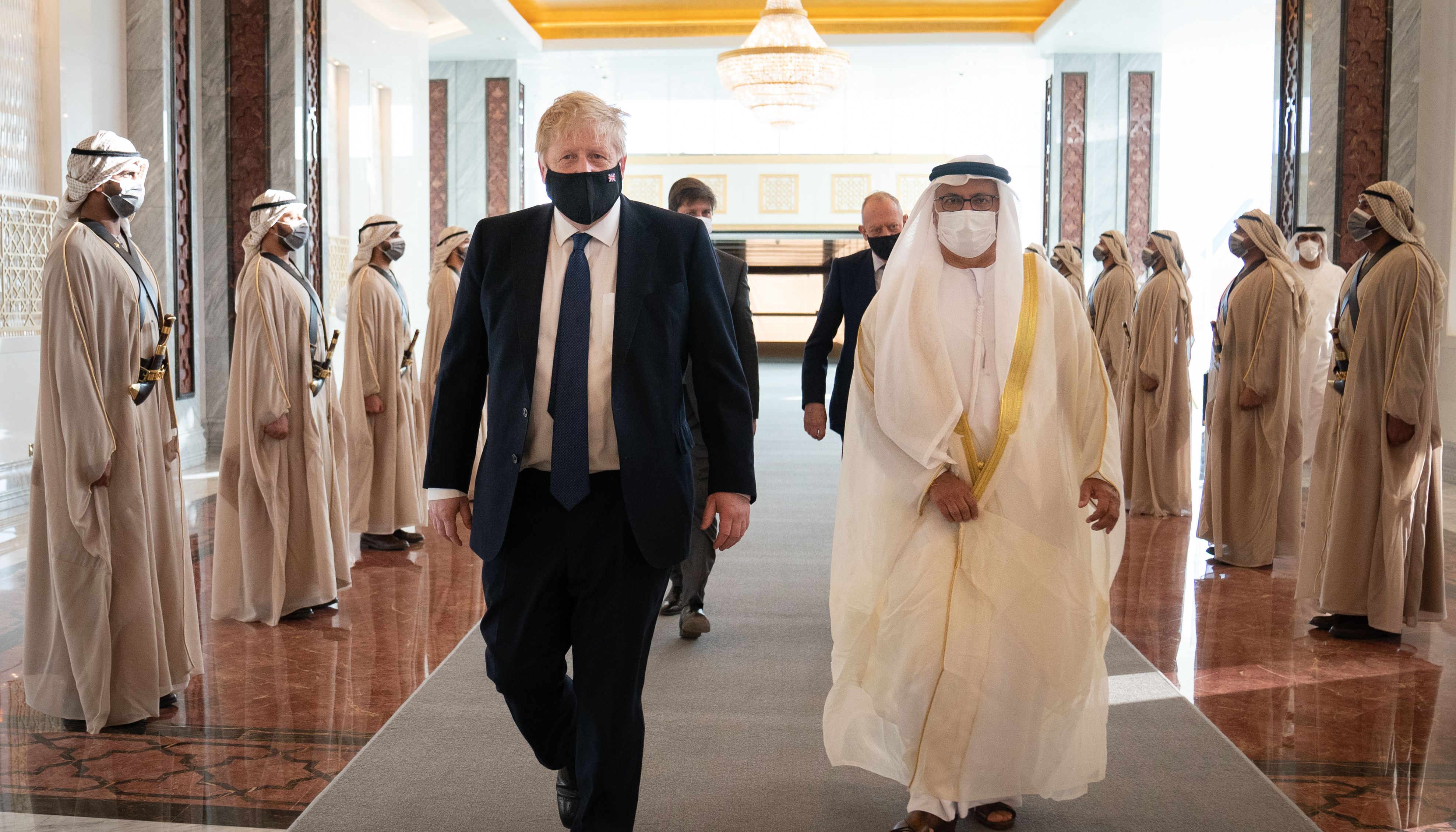 Prime Minister Boris Johnson inspects the Guard of Honour as he arrives at Abu Dhabi airport for his visit to the United Arab Emirates (UAE).