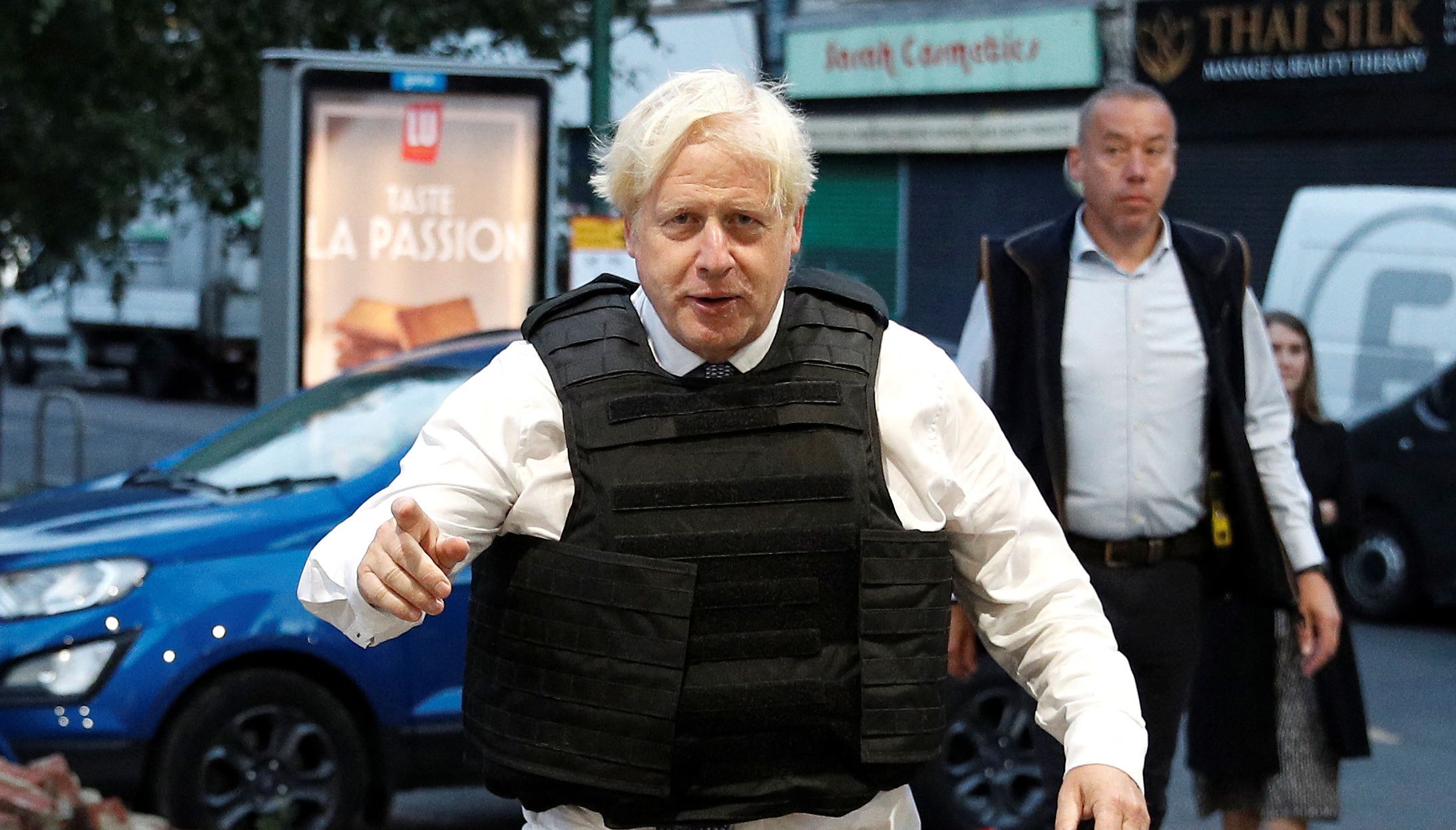 Prime Minister Boris Johnson leaves a property following a drugs related raid by Metropolitan Police officers, in West Norwood, London, as he undertakes visits to meet police recruits and speak to officers working in one of the 20 Violence Reduction Units. Picture date: Wednesday August 31, 2022.