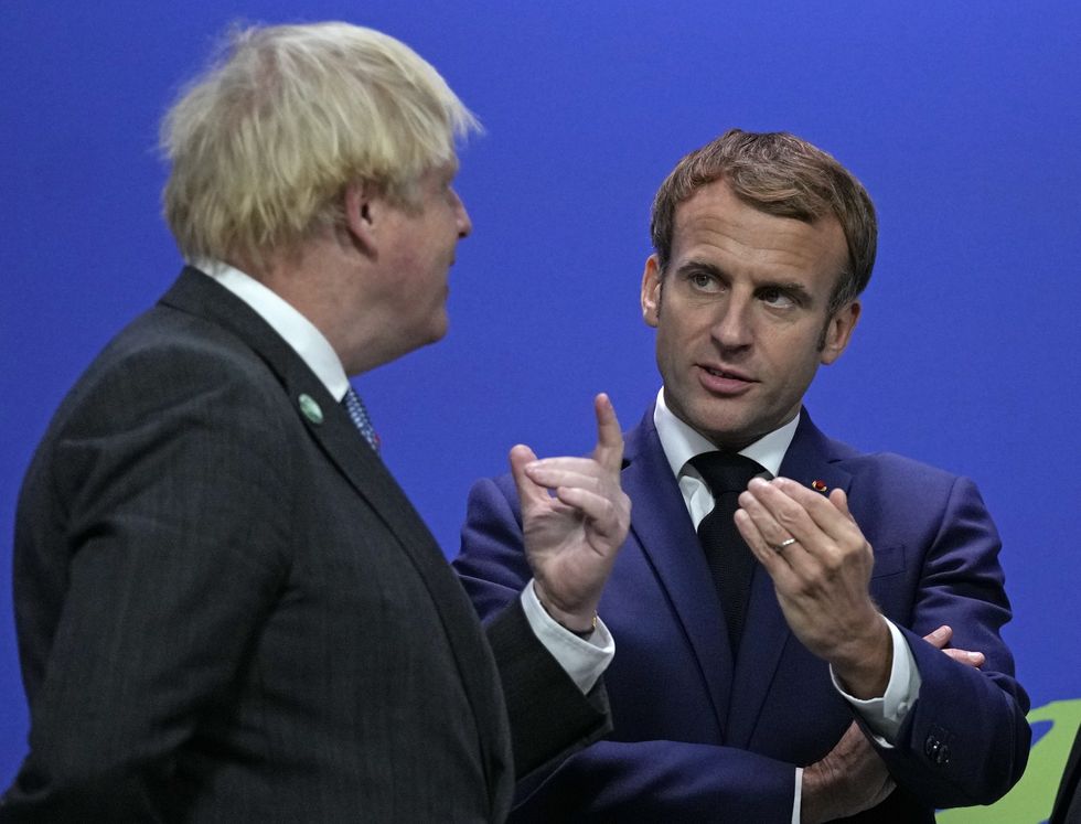 Prime Minister Boris Johnson (left) greets French President Emmanuel Macron at the Cop26 summit at the Scottish Event Campus (SEC) in Glasgow.
