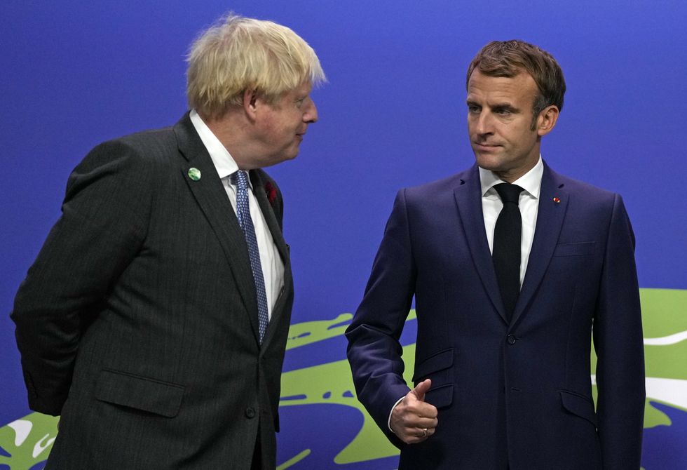 Prime Minister Boris Johnson (left) greets French President Emmanuel Macron at the Cop26 summit at the Scottish Event Campus (SEC) in Glasgow