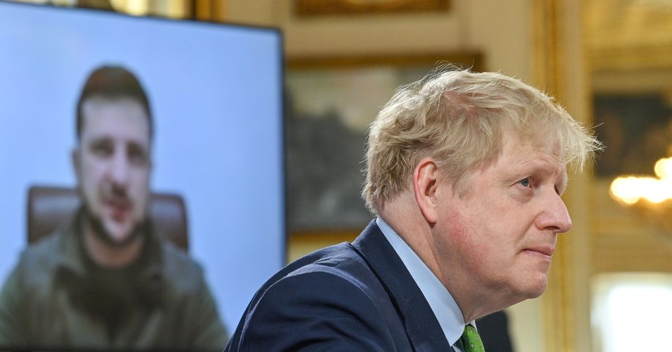 Prime Minister Boris Johnson listens as Ukrainian President Volodymyr Zelensky addresses by video link leaders attending a summit of the Joint Expeditionary Force (JEF) in London. Picture date: Tuesday March 15, 2022.